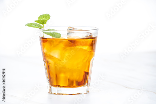 A strong drink with ice and mint