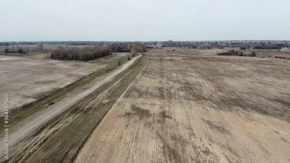 Dirt road in the fields, aerial view. Landscape. Dirt road in the fields, aerial view. Landscape.