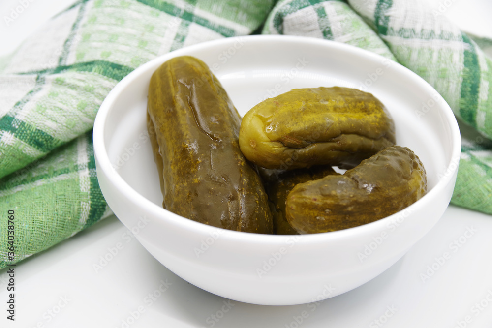 Marinated pickled cucumbers in bowl. Ingredients for cooking pickled cucumbers Marinated pickled cucumbers in bowl. Ingredients for cooking pickled cucumbers