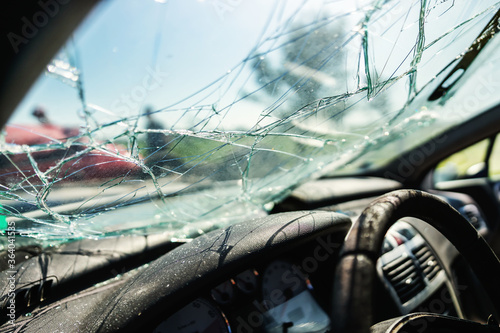 Closeup of crashed car window in car accident. photo