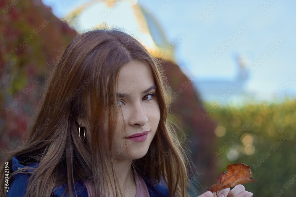 autumn portrait of a happy girl in the summer garden close up autumn portrait of a happy girl in the summer garden close up