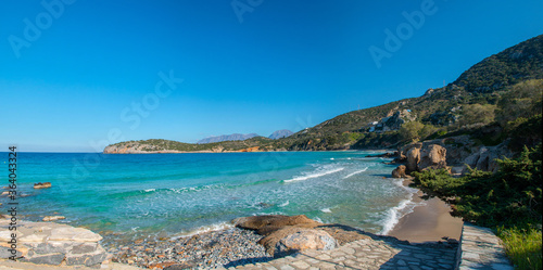 Tropical beach of Voulisma beach, Istron, Crete, Greece. Beautiful colorful beach Voulisma paradise beach with clear water. Summer vacation travel holiday background. HD panorama.