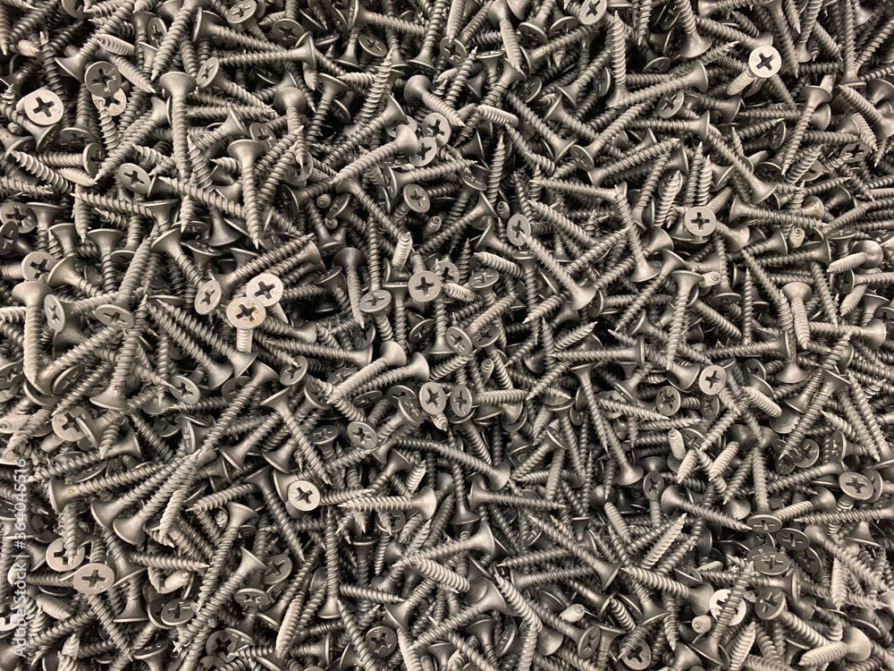 Concept of construction and repair. Black metal screws. Concept of construction and repair. Black metal screws.