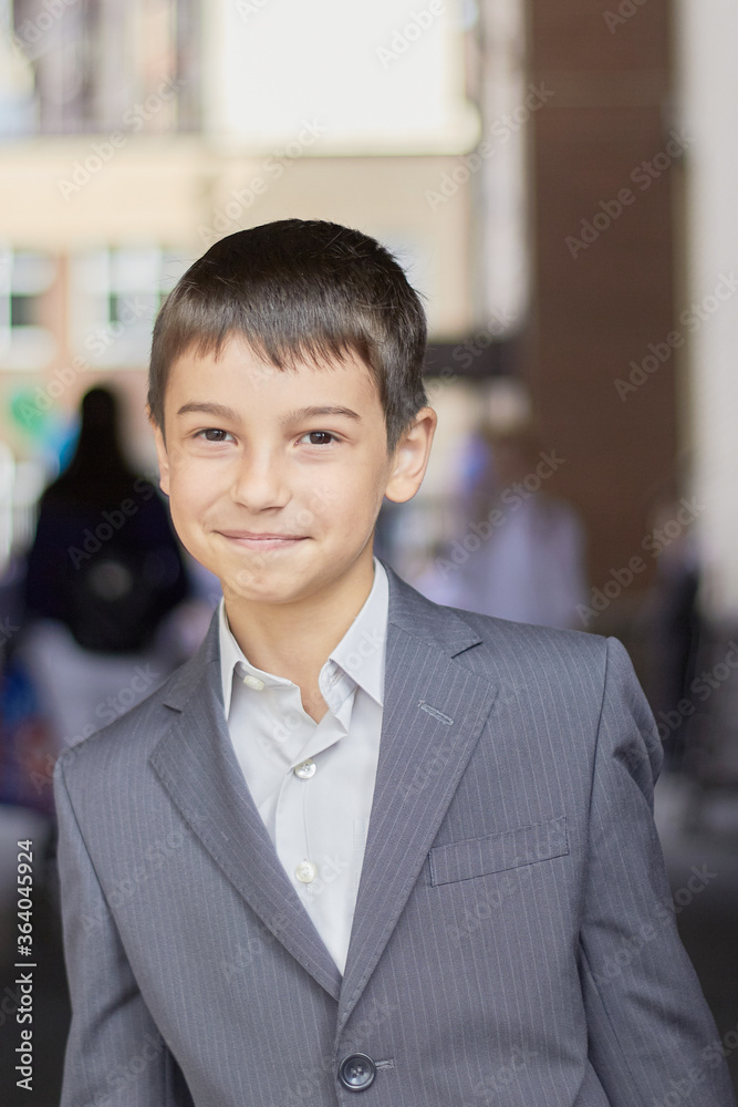 back to school portrait of a young boy with a backpack and a business suit back to school portrait of a young boy with a backpack and a business suit