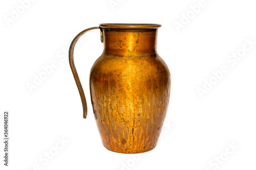 Small gold shiny old copper / bronze jug / pot with handle on a white studio background
