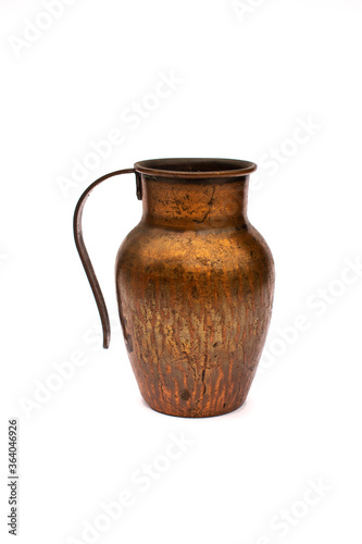 Small gold shiny old copper / bronze jug / pot with handle on a white studio background 
