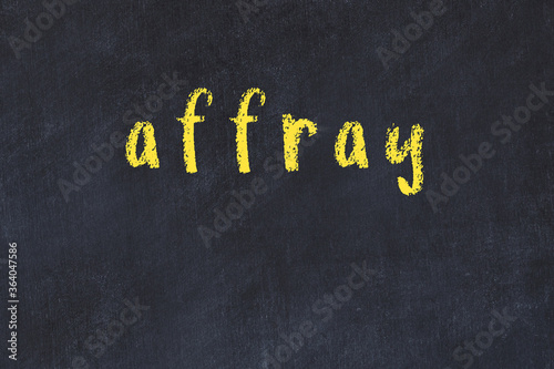 College chalk desk with the word affray written on in