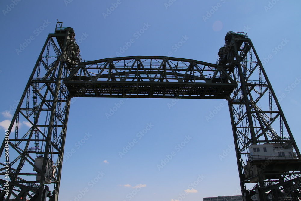 Open standing lift bridge called Hefbrug as a reminder of the trains that passed through Rotterdam on the Nieuwe Maas. Open standing lift bridge called Hefbrug as a reminder of the trains that passed through Rotterdam on the Nieuwe Maas.