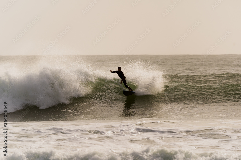 Surfer riding a wave.
