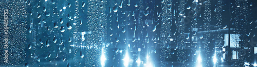 abstract background rain glass / autumn weather raindrops outside the window, cold october wallpaper © kichigin19
