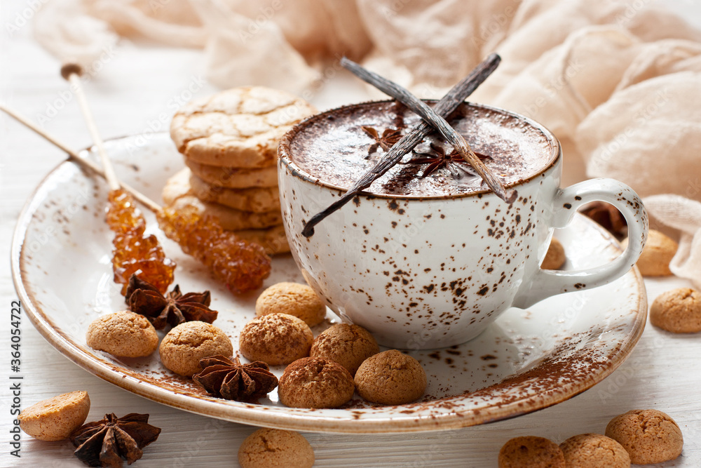 Hot cocoa drink with spices and almond cookies Hot cocoa drink with spices and almond cookies