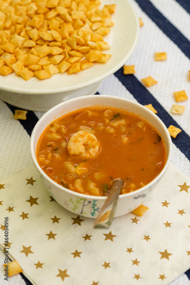 A luscious prawn/shrimp soup made with fresh prawns, coconut milk and has a elegantly laid background with copyspace A luscious prawn/shrimp soup made with fresh prawns, coconut milk and has a elegantly laid background with copyspace