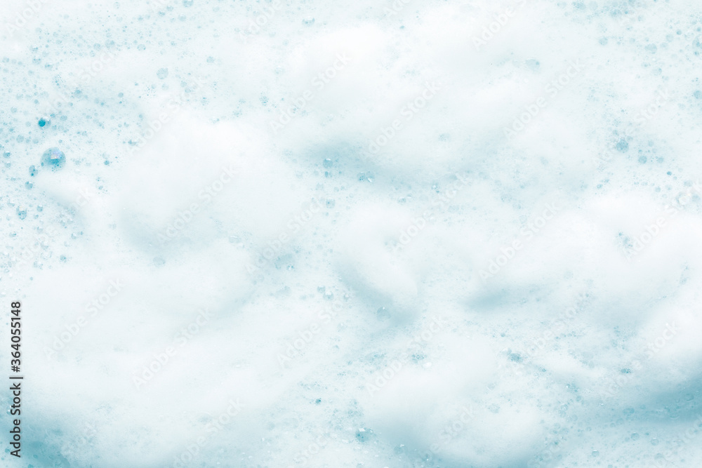 wet soap bubbles on blue water background. wet soap bubbles on blue water background.