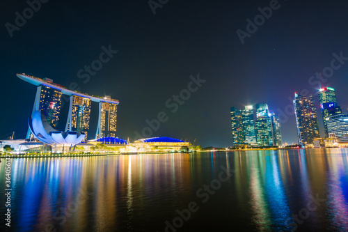 Beautiful architecture building skyscraper around marina bay in singapore city at night