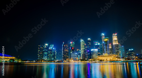 Beautiful architecture building skyscraper around marina bay in singapore city at night.