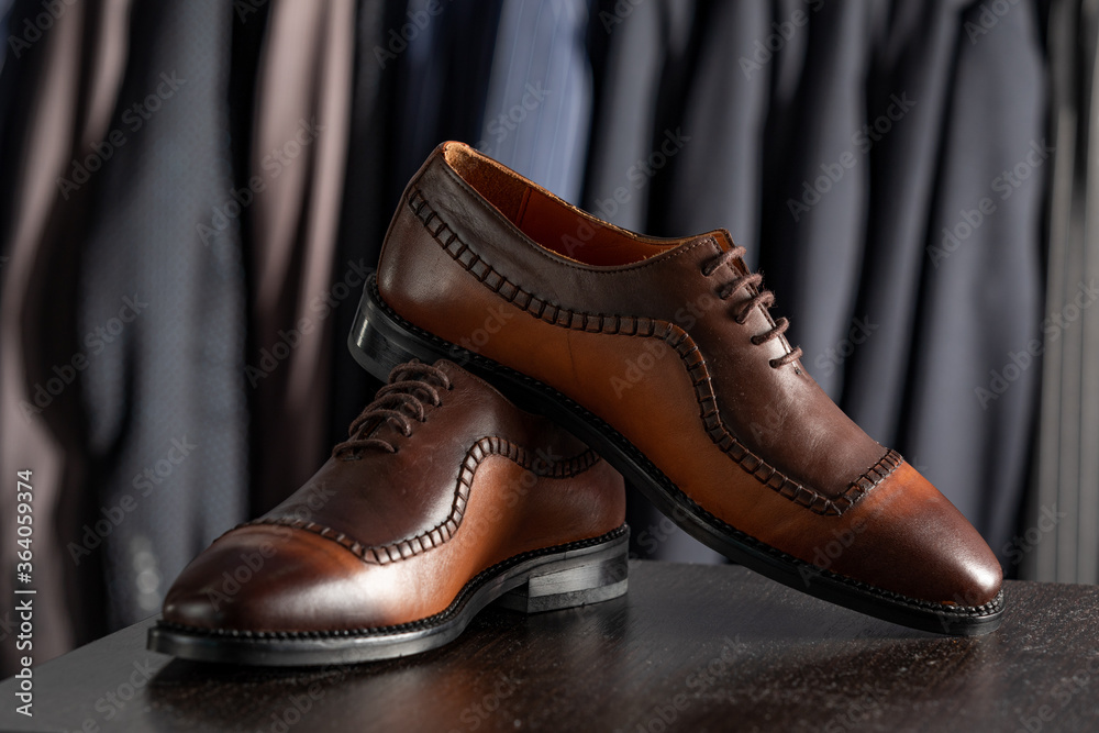Elegant leather male shoes in the shop. expensive modern shoes for men Elegant leather male shoes in the shop. expensive modern shoes for men