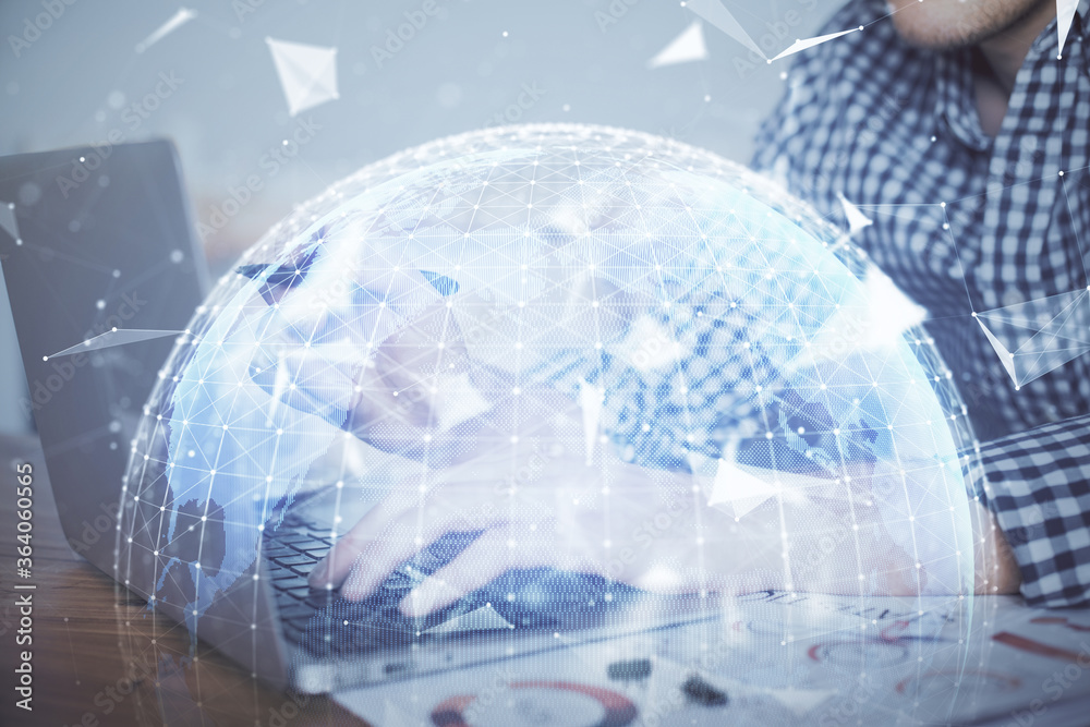Multi exposure of businessman working on laptop on background. International business hologram in front. Concept of success. Multi exposure of businessman working on laptop on background. International business hologram in front. Concept of success.