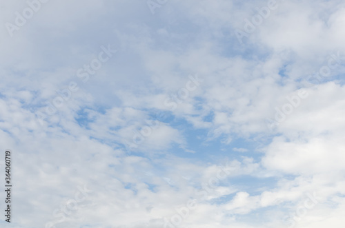 white fluffy clouds in the blue sky, Blue sky background with tiny clouds