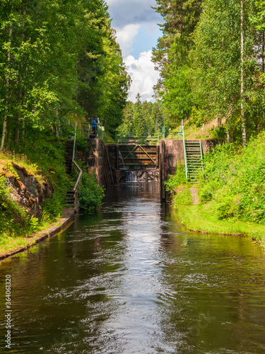 Idyllic canal lock in the forest