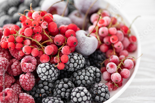 Wallpaper Mural assorted frozen berries on a white plate Torontodigital.ca