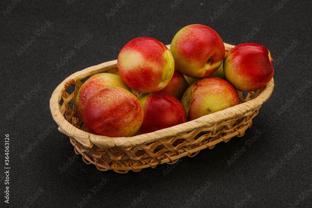 Sweet small nectarines in the basket Sweet small nectarines in the basket