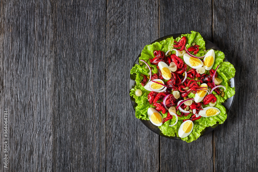 baby octopus salad with eggs, onion, lettuce