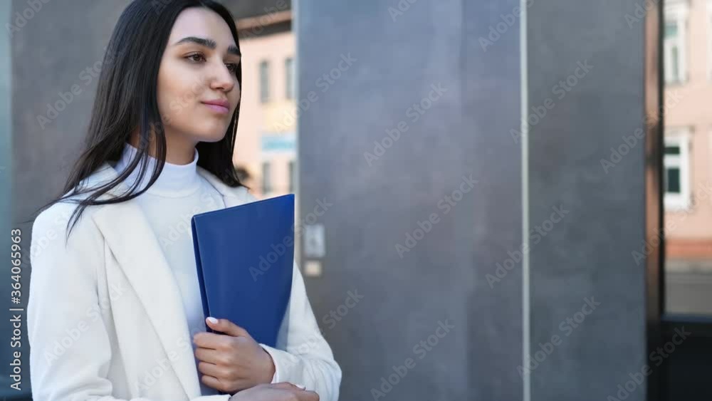 Closeup smiling business female holding folder with documents during movement. 4k Dragon RED camera