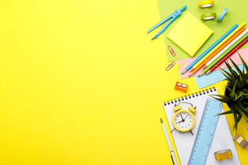 Back to school concept. Colorful stationary school supplies on yellow  background, space or text flat lay