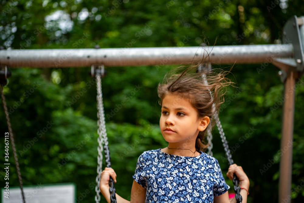 beautiful girl on a playground in a leisure park beautiful girl on a playground in a leisure park