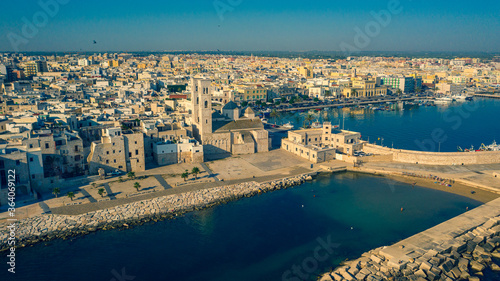 Beautiful panoramic aerial view photo from flying drone to Molfetta beach and Old Town skyline and views of the harbor. A tourist resort in southern Italy.Molfetta town in Apulia, Italy (Series)