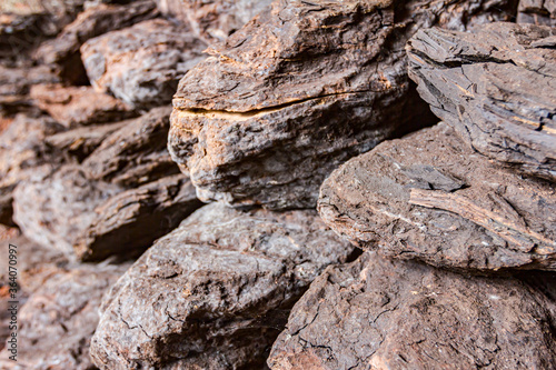 Dry charcoal pile stacked in basement