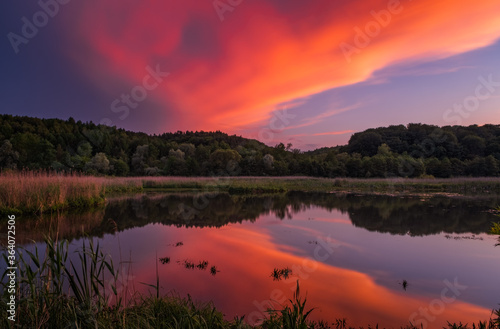 Fantastic beautiful sunset evening view on lake in Stradch, Lviv district. june 2020. Long exposure shot.