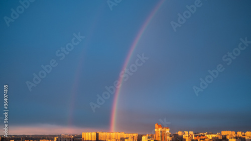 Fotografia Beautiful sky with Cumulus clouds, rainbow after a thunderstorm,