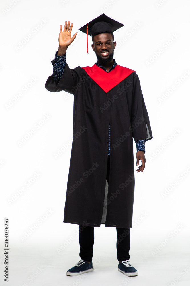 Young african american male graduate full length on white background