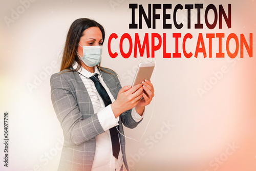 Writing note showing Infection Complication. Business concept for unwanted reaction resulted from an immunosuppression Promoting health awareness with set of medical precautionary equipment photo