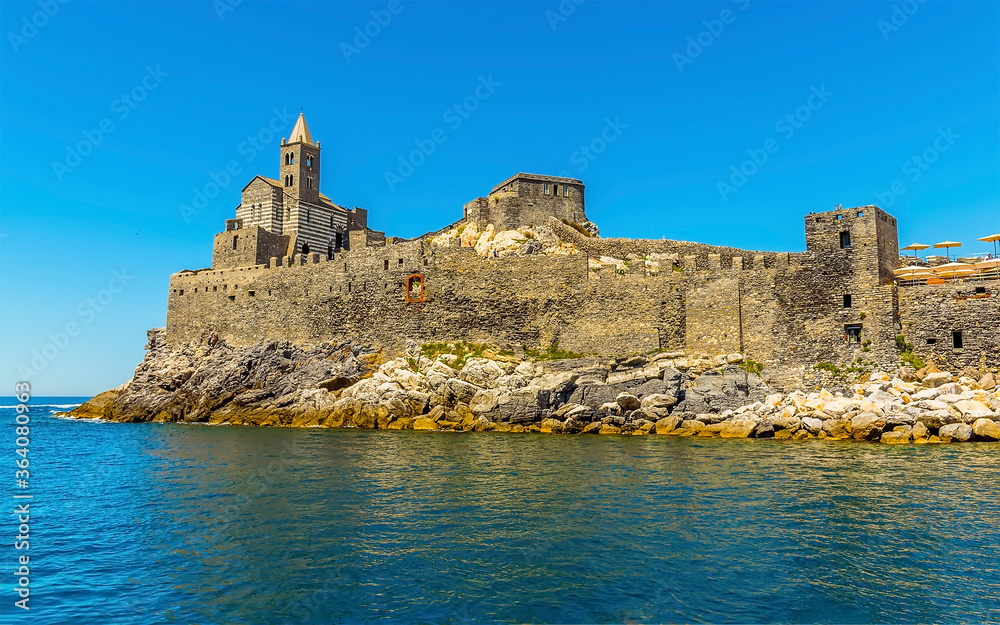 A view towards the church of Saint Peter in Porto Venere, Italy in the summertime