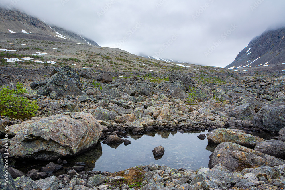 Obraz premium View of the area near The Lake Blavatnet, rocks and water, Lyngen Alps, Norway