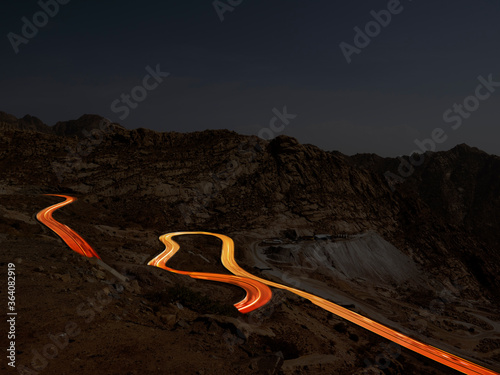 Al Hada Mountains near Taif, dangerous Al Hada road mountain pass with night  time head light trails, in western Saudi Arabia photo