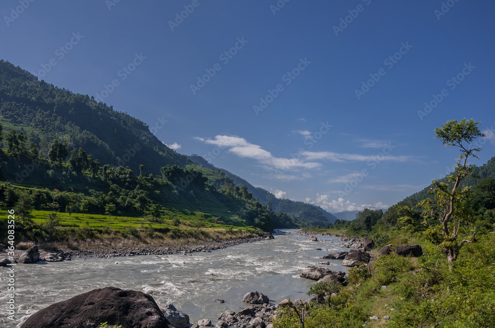 Fototapeta premium Budhi Gandaki river, a tributary of Gandaki/Narayani river as seen along Manaslu Circuit trek route from Arughat Bazar to Jagat villages, Gorkha district, Nepal Himalaya, Nepal.