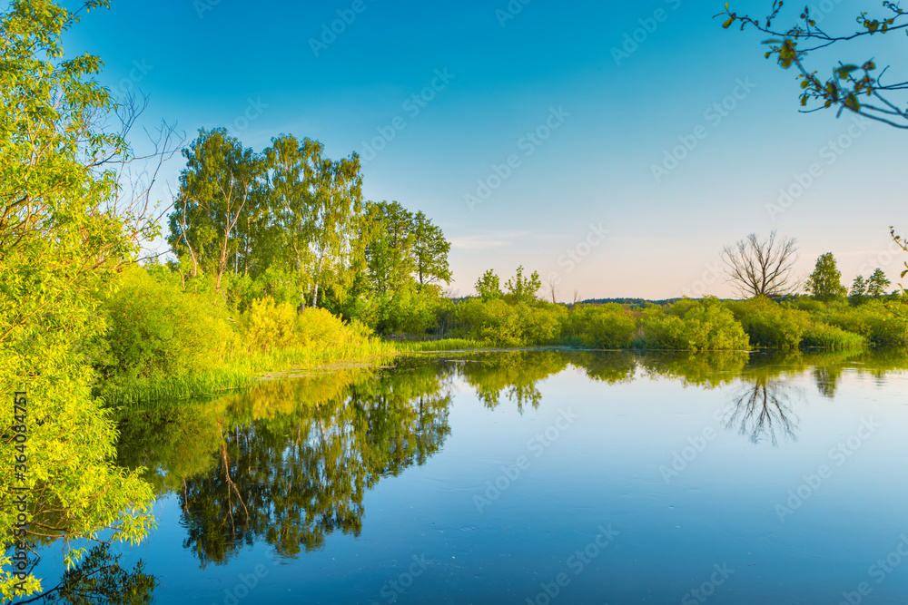 Lake water sunset and nature autumn landscape with blue sky
