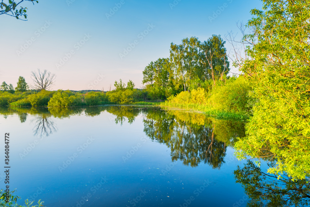 Obraz premium Lake water sunset and nature autumn landscape with blue sky