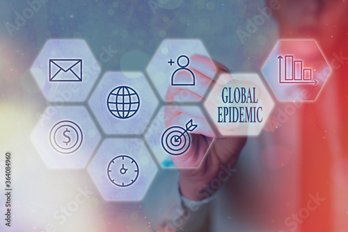 Conceptual hand writing showing Global Epidemic. Concept meaning a rapid spread of a communicable disease over a wide geographic area Grids and different icons latest digital technology concept photo