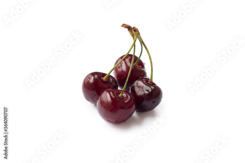 Ripe sweet cherries on twigs isolated on white background