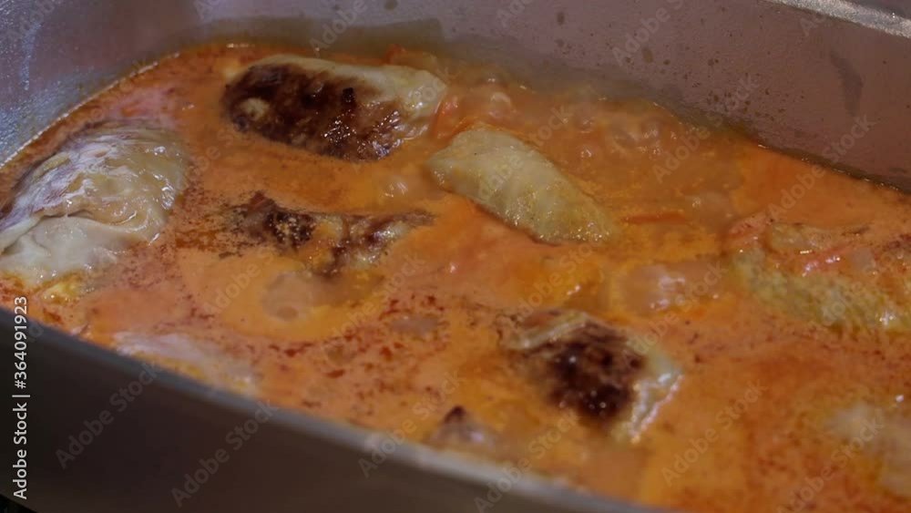 stuffed meat and seasoning are cooked in a pan and fried in a pan stuffed meat and seasoning are cooked in a pan and fried in a pan