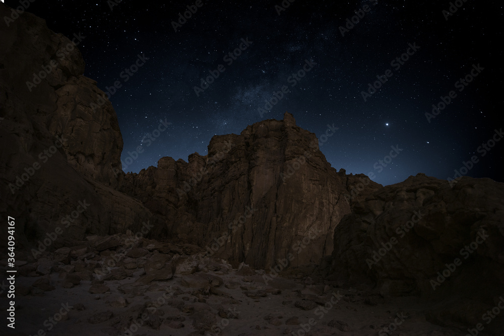 Timna valley national park nightscape of a mountains and stars. milky way .