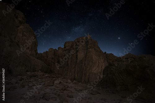 Timna valley national park nightscape of a mountains and stars. milky way .