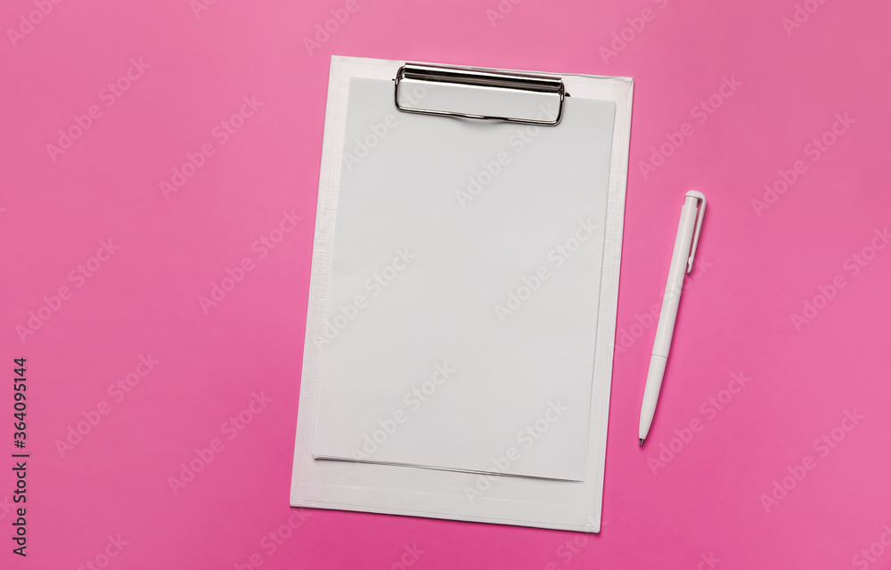 White clipboard with blank sheet of paper and pen White clipboard with blank sheet of paper and pen