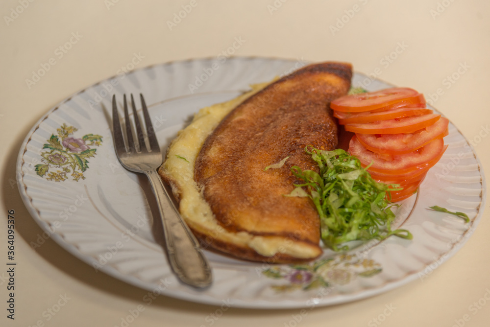Fluffy omelette with tomatoes and greens Fluffy omelette with tomatoes and greens