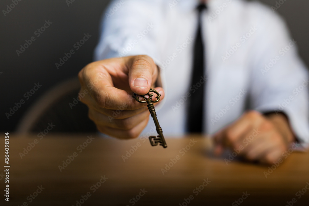 Key to success in businessman hand on background of the sky. Key to success in businessman hand on background of the sky.
