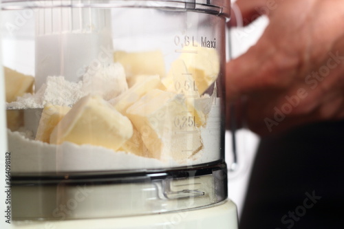 Flour and diced butter in food processor cup. Making Shoofly Tart Series. photo